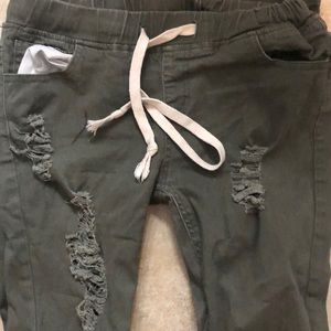 Distressed olive jeans
